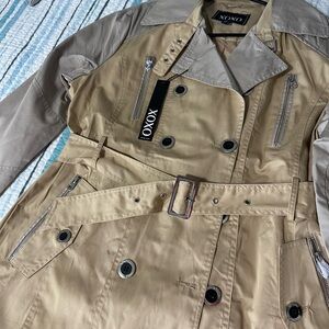 Brand new. Fashion coat. It’s an XL but it runs small.